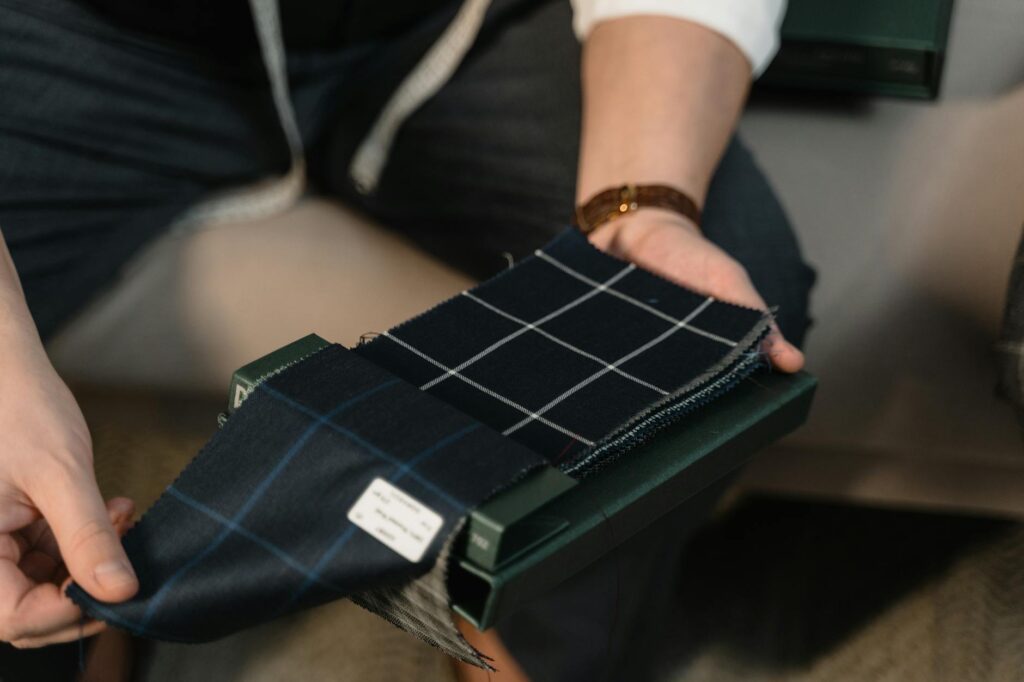 a person holding checkered fabric palette
